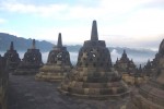 Sunrise from Punthuk Setumbu Hill overlooking Borobudur Temple and Mount Merapi