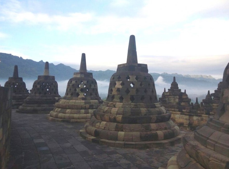 Sunrise from Punthuk Setumbu Hill overlooking Borobudur Temple and Mount Merapi