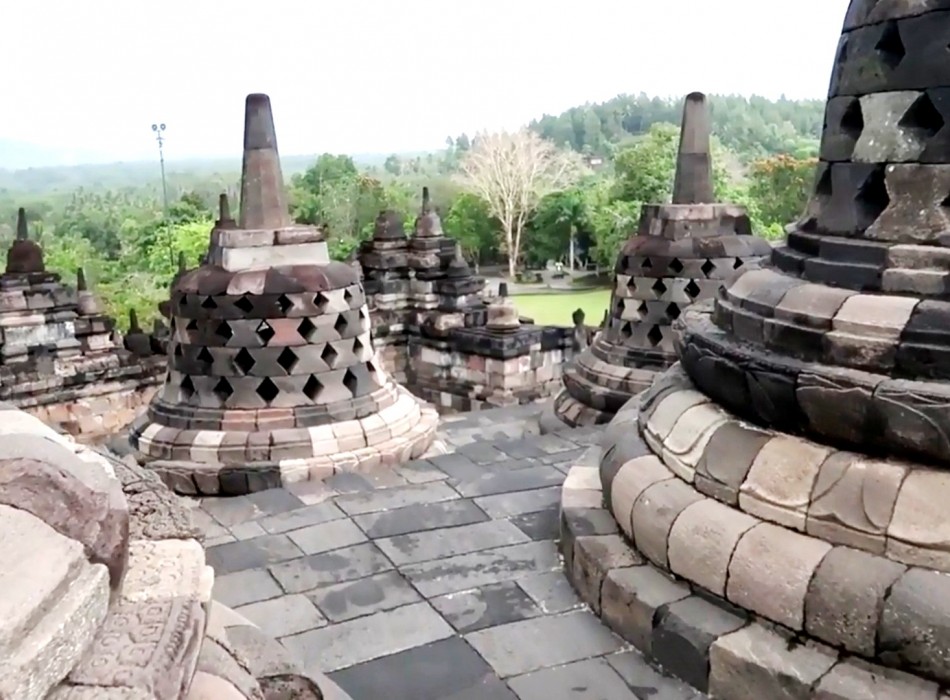 Sunrise from Punthuk Setumbu Hill overlooking Borobudur Temple and Mount Merapi